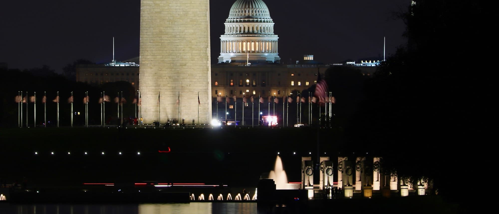 The U.S. Capitol building illuminated at night behind the Washington Monument, evoking U.S. Treasury and government debt markets