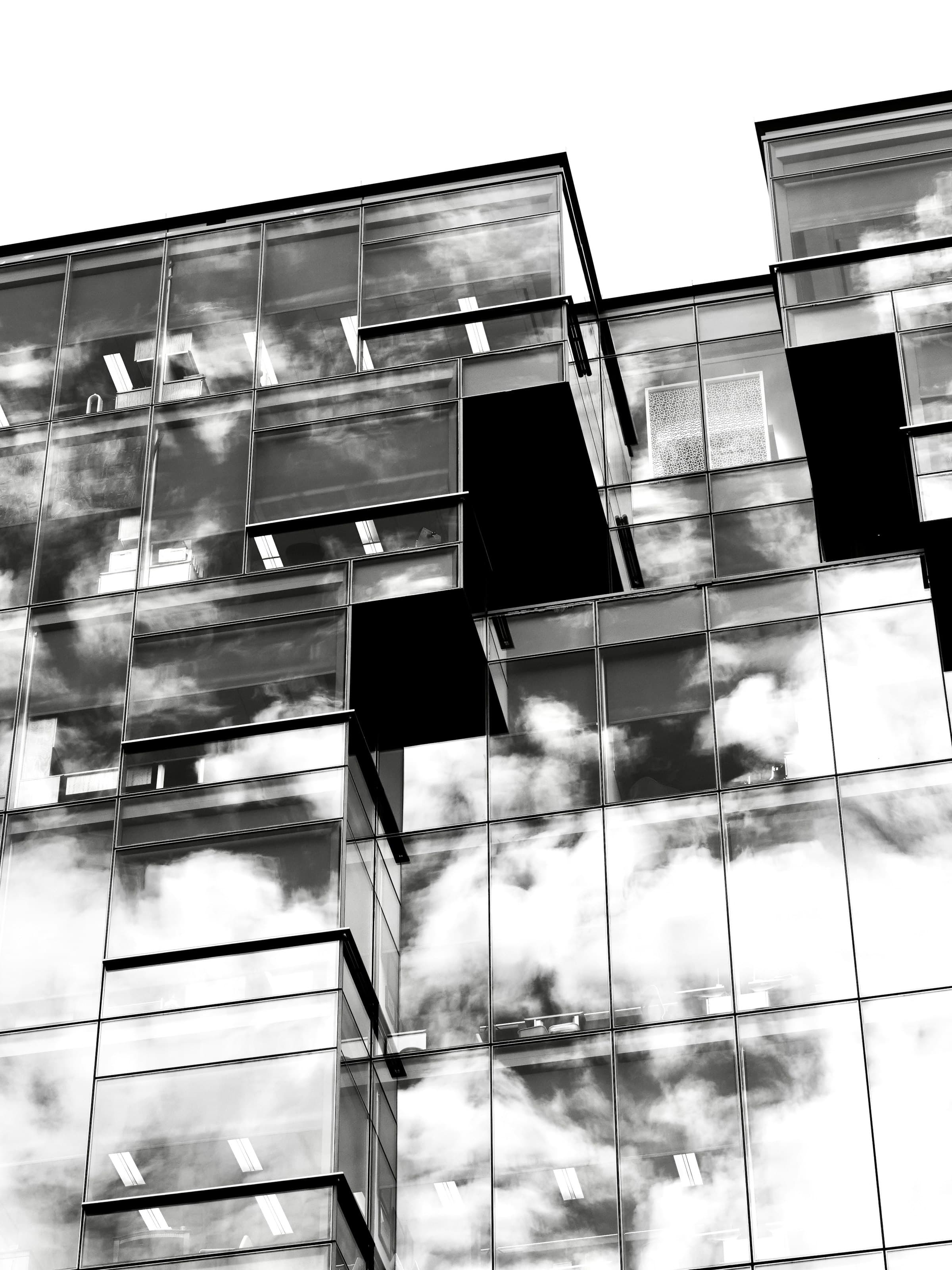 Modern office building facade viewed from below